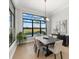 Bright dining room with water views and large windows at 9020 Artisan Way, Sarasota, FL 34240