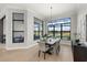 Spacious dining room featuring large windows and water views at 9020 Artisan Way, Sarasota, FL 34240