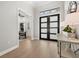 Elegant entryway offering views into an office and living spaces at 9020 Artisan Way, Sarasota, FL 34240