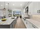 Open concept kitchen with large island and stainless steel appliances at 9020 Artisan Way, Sarasota, FL 34240
