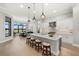 Gourmet kitchen with island, stainless steel appliances, and white cabinetry at 9020 Artisan Way, Sarasota, FL 34240