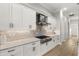 Modern kitchen with stainless steel appliances and white cabinets at 9020 Artisan Way, Sarasota, FL 34240
