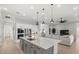 Spacious kitchen with island, stainless steel appliances, and open floor plan at 9020 Artisan Way, Sarasota, FL 34240