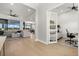 Open concept living room with office and view into backyard at 9020 Artisan Way, Sarasota, FL 34240