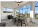Covered patio with dining area and grill at 9020 Artisan Way, Sarasota, FL 34240