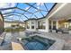 Luxury pool and spa with covered patio, and access to the house at 9020 Artisan Way, Sarasota, FL 34240