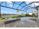 Spacious pool and spa with a covered patio and serene views at 9020 Artisan Way, Sarasota, FL 34240