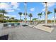 Spacious pool deck with lounge chairs and palm trees at 9020 Artisan Way, Sarasota, FL 34240