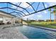 Enjoy this relaxing pool and patio area, complete with a covered cabana and outdoor kitchen at 9020 Artisan Way, Sarasota, FL 34240