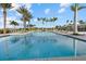 Large, refreshing pool surrounded by palm trees at 9020 Artisan Way, Sarasota, FL 34240