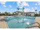 Relaxing pool area with lounge chairs and palm trees at 9020 Artisan Way, Sarasota, FL 34240
