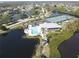 Aerial view of community amenities including pool, tennis courts, and kayaks at 919 Waterside Ln, Bradenton, FL 34209