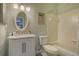 Clean bathroom with bathtub, vanity, and tiled walls at 919 Waterside Ln, Bradenton, FL 34209