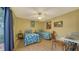 Guest bedroom with twin beds, and access to private patio at 919 Waterside Ln, Bradenton, FL 34209