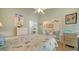 Bedroom with sitting area and access to another room at 919 Waterside Ln, Bradenton, FL 34209
