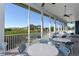 Relaxing screened-in community patio with outdoor seating at 919 Waterside Ln, Bradenton, FL 34209