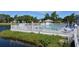 Inviting community pool with ample seating and lush landscaping at 919 Waterside Ln, Bradenton, FL 34209
