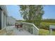Deck with seating area and view of lush greenery at 919 Waterside Ln, Bradenton, FL 34209