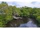 Wooden dock with gazebo providing waterfront access at 919 Waterside Ln, Bradenton, FL 34209
