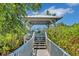 Charming gazebo with walkway leading to waterfront access at 919 Waterside Ln, Bradenton, FL 34209