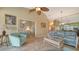 Living room offering access to bedroom and dining area, creating an open floor plan at 919 Waterside Ln, Bradenton, FL 34209