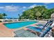 Relaxing community pool with lounge chairs at 919 Waterside Ln, Bradenton, FL 34209