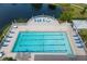 Inviting community swimming pool with lounge chairs at 919 Waterside Ln, Bradenton, FL 34209
