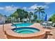 Community pool and spa with patio furniture at 919 Waterside Ln, Bradenton, FL 34209