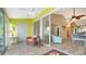 Sunroom with tiled floor, offering relaxing views and access to living area at 919 Waterside Ln, Bradenton, FL 34209