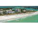 Aerial view of beachfront property with resort amenities and stunning ocean views at 100 Sands Point Rd # 323, Longboat Key, FL 34228