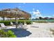 Beach access with shaded seating area at 100 Sands Point Rd # 323, Longboat Key, FL 34228