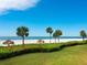 Stunning beachfront view with lush landscaping at 100 Sands Point Rd # 323, Longboat Key, FL 34228