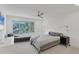 Serene bedroom with a plush bed, window seat, and plenty of natural light at 100 Sands Point Rd # 323, Longboat Key, FL 34228