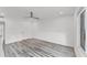 Simple bedroom with wood flooring and plenty of natural light at 100 Sands Point Rd # 323, Longboat Key, FL 34228