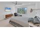 Bright bedroom with large window and comfortable bed at 100 Sands Point Rd # 323, Longboat Key, FL 34228