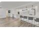 Modern white kitchen with stainless steel appliances and ample counter space at 100 Sands Point Rd # 323, Longboat Key, FL 34228