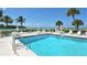 Relaxing pool area with ocean view at 100 Sands Point Rd # 323, Longboat Key, FL 34228