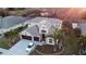 Two-story house with three-car garage; landscaped yard at 1178 Fraser Pine Blvd, Sarasota, FL 34240