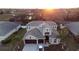 Two-story house with three-car garage; landscaped yard at 1178 Fraser Pine Blvd, Sarasota, FL 34240