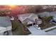 Two-story house with three-car garage; landscaped yard at 1178 Fraser Pine Blvd, Sarasota, FL 34240