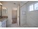 Modern bathroom with granite vanity and walk-in shower at 1178 Fraser Pine Blvd, Sarasota, FL 34240