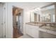 Bathroom with granite countertops, double sinks and a view into another room at 1178 Fraser Pine Blvd, Sarasota, FL 34240