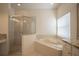 Bathroom with soaking tub, shower, and granite vanity at 1178 Fraser Pine Blvd, Sarasota, FL 34240