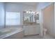 Bathroom with corner soaking tub and granite vanity at 1178 Fraser Pine Blvd, Sarasota, FL 34240