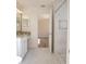 Bathroom with shower, granite vanity, and view of bedroom at 1178 Fraser Pine Blvd, Sarasota, FL 34240