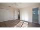 Well-lit bedroom with hardwood floors and double doors at 1178 Fraser Pine Blvd, Sarasota, FL 34240