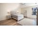 Bright bedroom with wood floors, a large bed, and ample natural light at 1178 Fraser Pine Blvd, Sarasota, FL 34240