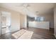 Spacious bonus room with hardwood floors and a view of a bathroom at 1178 Fraser Pine Blvd, Sarasota, FL 34240