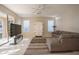 Bright Gathering room features tile floors, a comfy sectional sofa, and sliding glass doors at 1178 Fraser Pine Blvd, Sarasota, FL 34240