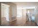 Hardwood floor hallway with access to bedrooms and stairs at 1178 Fraser Pine Blvd, Sarasota, FL 34240